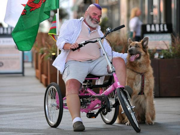 How a Bright Pink trike can help ‘a Guy’ with MS to walk his dog again