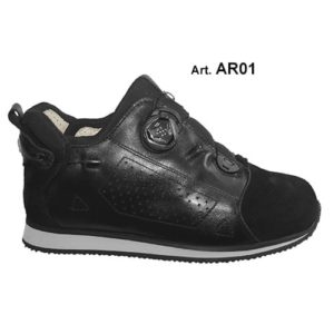 A black shoe with a cream-coloured lining and a small device on the front, and joins in the heels, to lace it up.