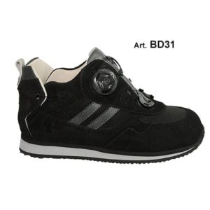 A black shoe with a cream-coloured lining and a small device on the front, and joins in the heels, to lace it up.