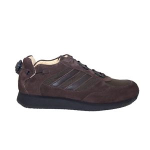 A brown shoe with a cream-coloured lining and a small device on the back to lace it up.