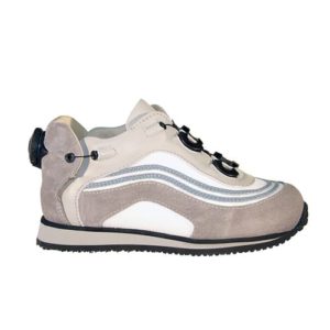 A small light brown shoe with a cream-coloured lining and a small device on the back to lace it up.