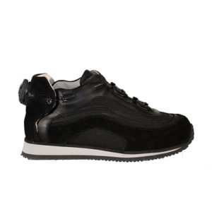 A black shoe with a cream-coloured lining and a small device on the back to lace it up.