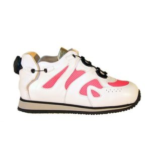 A small pink and white shoe with a cream-coloured lining and a small device on the back to lace it up.