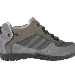 A light brown shoe with a cream-coloured lining and a small device on the back to lace it up.