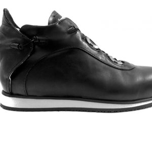 A small black shoe with a cream-coloured lining and a small device on the back to lace it up.