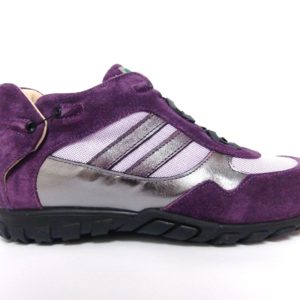 A purple shoe with a cream-coloured lining and a small device on the back to lace it up.
