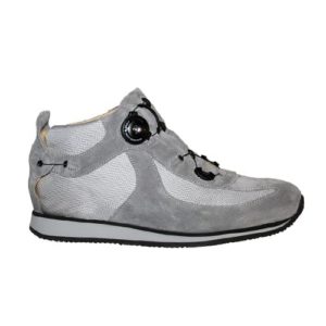 A grey shoe with a small device on the front, and joins in the heels, to lace it up.