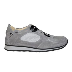 A grey shoe with a cream-coloured lining and a small device on the front, and joins in the heels, to lace it up.
